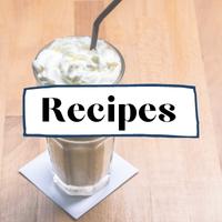 Coffee recipes text overlay on top of image of cold coffee beverage with whipped cream sitting on a table on top of a coaster.  black straw sticking out the top