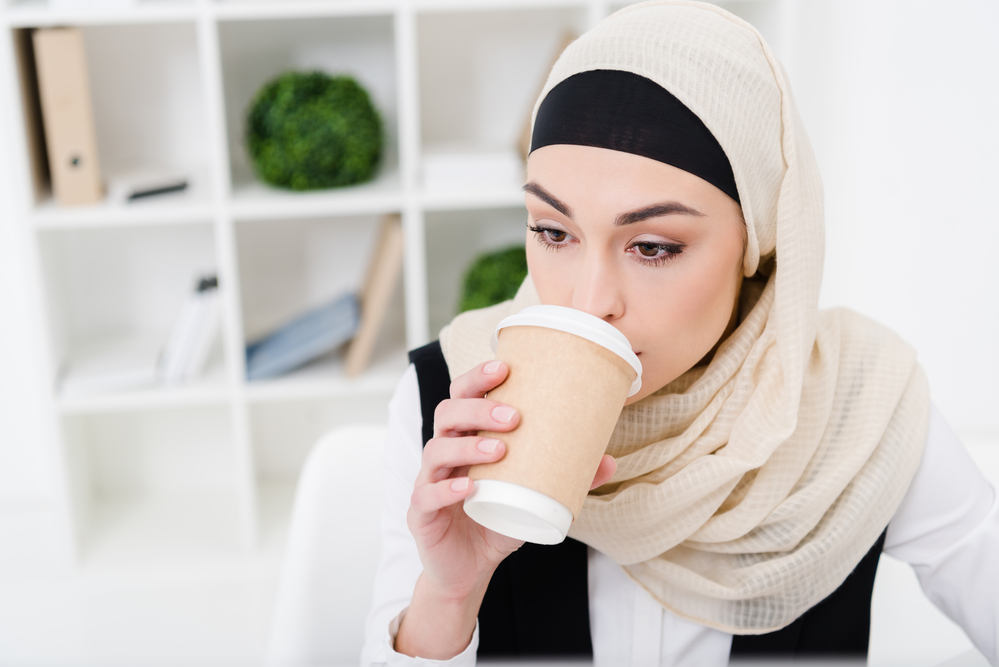 muslim lady drinking coffee